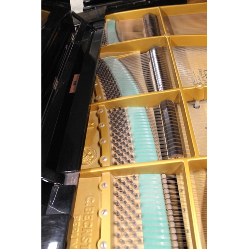 26 - Bechstein (c1920s)A 5ft 10in Model M grand piano in a bright ebonised case on square tapered legs; t... 