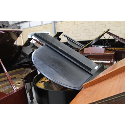 3 - Bechstein (c1931)A 5ft 10in Model M grand piano in an ebonised case on square tapered legs; together... 