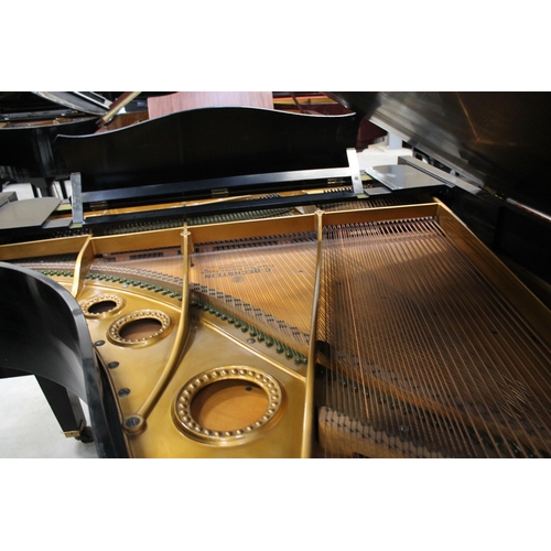 3 - Bechstein (c1931)A 5ft 10in Model M grand piano in an ebonised case on square tapered legs; together... 