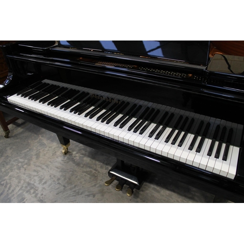 30 - Bösendorfer (c1986)A 6ft 7in Model 200 grand piano in a bright ebonised case on square tapered legs;... 