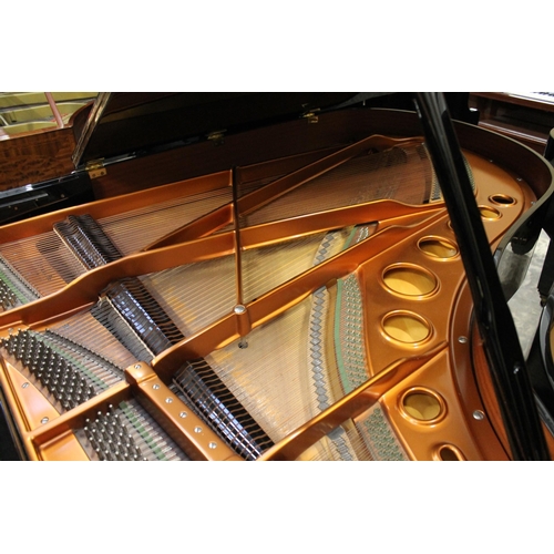 30 - Bösendorfer (c1986)A 6ft 7in Model 200 grand piano in a bright ebonised case on square tapered legs;... 