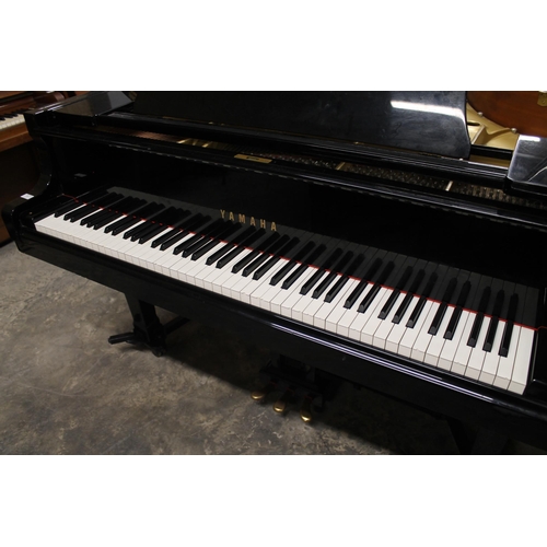 7 - Yamaha (c1992)A 6ft 1in Model C3 grand piano in a bright ebonised case on square tapered legs, on an... 