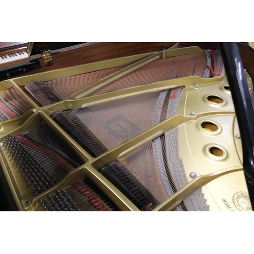 7 - Yamaha (c1992)A 6ft 1in Model C3 grand piano in a bright ebonised case on square tapered legs, on an... 