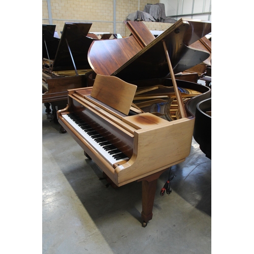 18 - Blüthner (c1979)A 6ft 3in grand piano in a bright walnut case on square tapered legs.