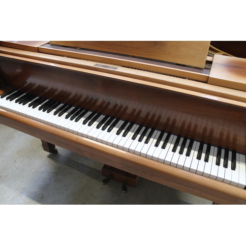 18 - Blüthner (c1979)A 6ft 3in grand piano in a bright walnut case on square tapered legs.