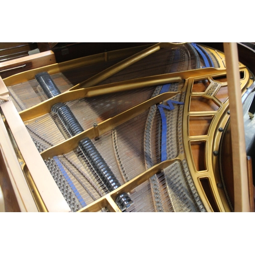 18 - Blüthner (c1979)A 6ft 3in grand piano in a bright walnut case on square tapered legs.