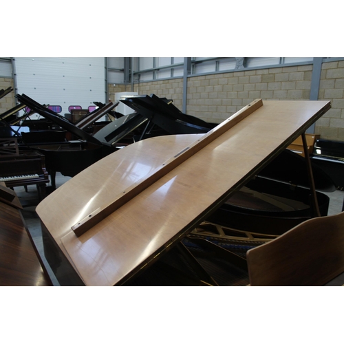 18 - Blüthner (c1979)A 6ft 3in grand piano in a bright walnut case on square tapered legs.