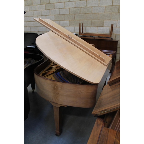 18 - Blüthner (c1979)A 6ft 3in grand piano in a bright walnut case on square tapered legs.
