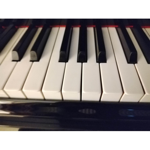 26 - Steinway (c1928)A 5ft 10in Model O grand piano in a bright ebonised case on square tapered legs. Thi... 