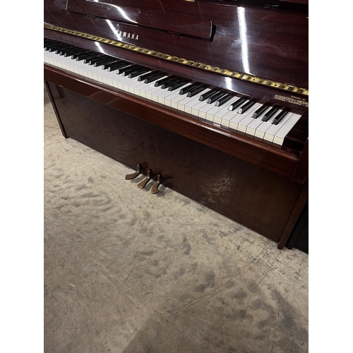 101 - Yamaha (c1980)A Model M5J upright piano in a bright mahogany case; together with a stool.