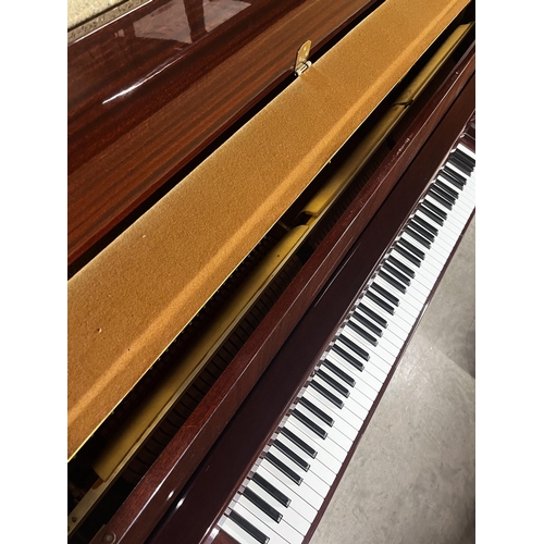 101 - Yamaha (c1980)A Model M5J upright piano in a bright mahogany case; together with a stool.