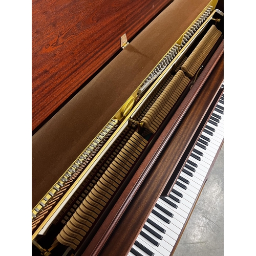 106 - Chappell (c1988)An upright piano in a traditional case with figured mahogany front panel; together w... 