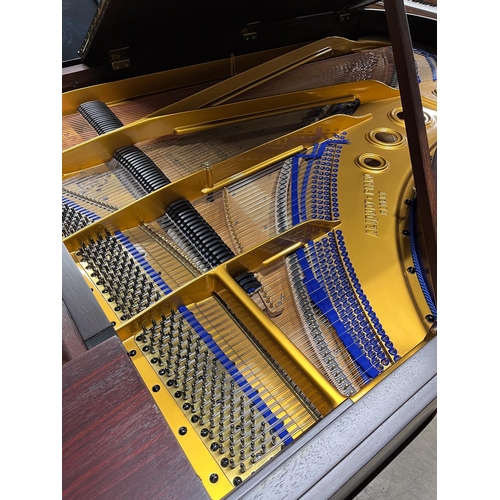 109 - Blüthner (c1910)A 7ft 3in grand piano in a rosewood case, fitted with a roller action, raised on tur... 