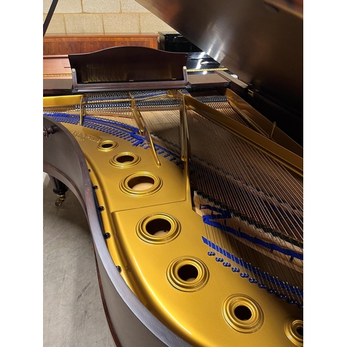 109 - Blüthner (c1910)A 7ft 3in grand piano in a rosewood case, fitted with a roller action, raised on tur... 