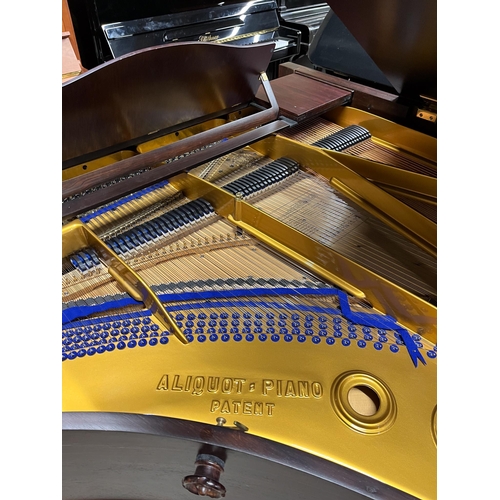 109 - Blüthner (c1910)A 7ft 3in grand piano in a rosewood case, fitted with a roller action, raised on tur... 