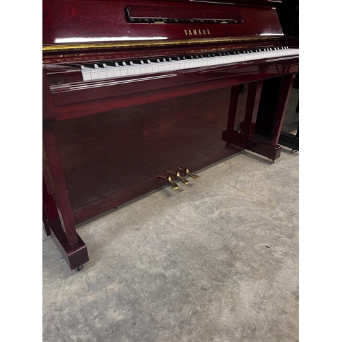 11 - Yamaha (c2006)A Model YU 121C upright piano in a bright mahogany case; together with a stool.