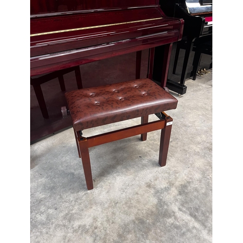 11 - Yamaha (c2006)A Model YU 121C upright piano in a bright mahogany case; together with a stool.