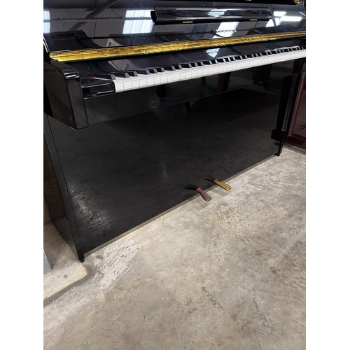 111 - Yamaha (c1995)A Model E108 upright piano in a bright ebonised case; together with a matching stool.... 