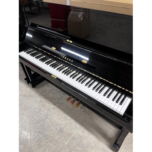 114 - Yamaha (c1985)A Model U1 upright piano in a bright ebonised case.