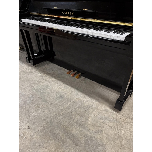 114 - Yamaha (c1985)A Model U1 upright piano in a bright ebonised case.
