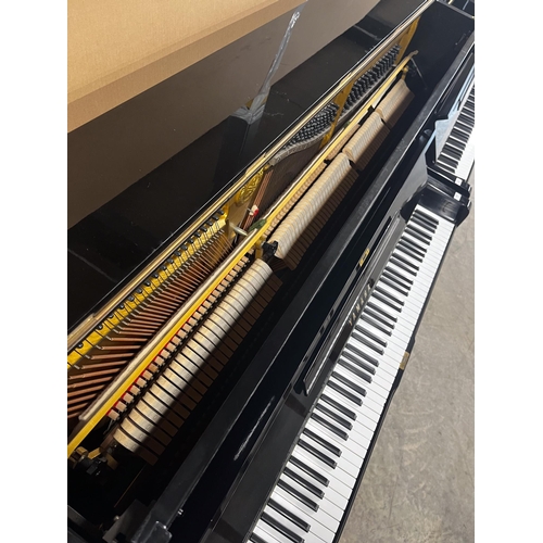 117 - Yamaha (c1974)A Model U3H upright piano in a bright ebonised case.