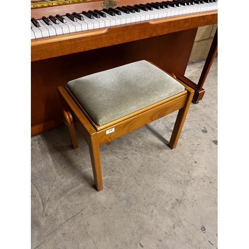 119 - Kemble (c1997)An upright piano in a traditional crossbanded yew and cherry wood case; together with ... 