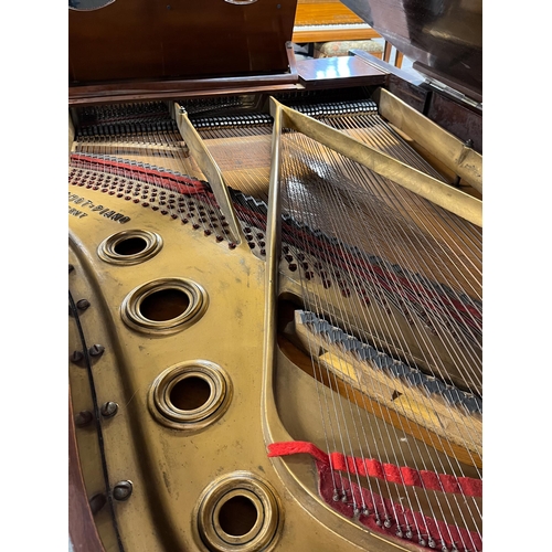 12 - Blüthner (c1886)A grand piano in a carved mahogany and blue painted case, raised on 3 sets of dual t... 