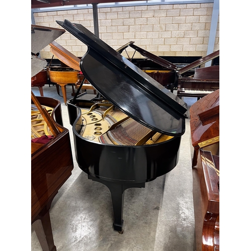 15 - Steinway (c1936)A 5ft 7in Model M grand piano in an ebonised case on square tapered legs; together w... 