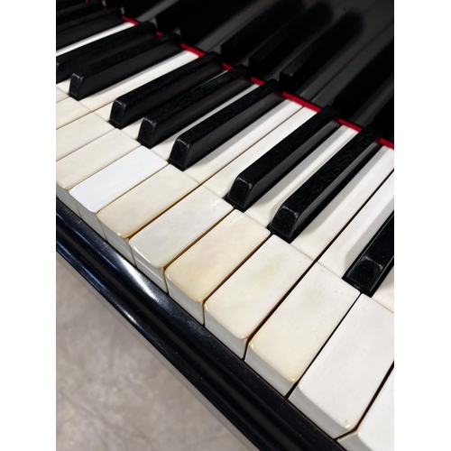 15 - Steinway (c1936)A 5ft 7in Model M grand piano in an ebonised case on square tapered legs; together w... 