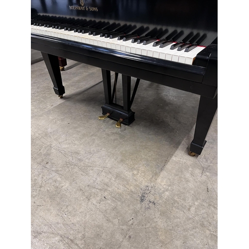 15 - Steinway (c1936)A 5ft 7in Model M grand piano in an ebonised case on square tapered legs; together w... 