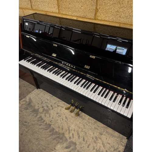 16 - Eterna (c2002) (by Yamaha)A Model ER-C10 upright piano in a modern style bright ebonised case.