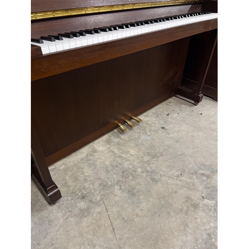 19 - Yamaha (c2000)A Model P110N upright piano in a modern style satin mahogany case; together with a sto... 