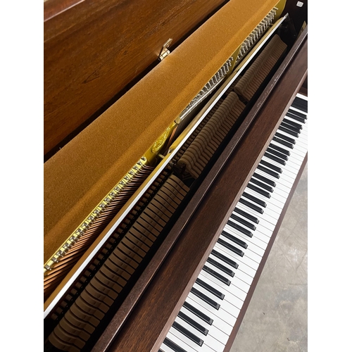 19 - Yamaha (c2000)A Model P110N upright piano in a modern style satin mahogany case; together with a sto... 