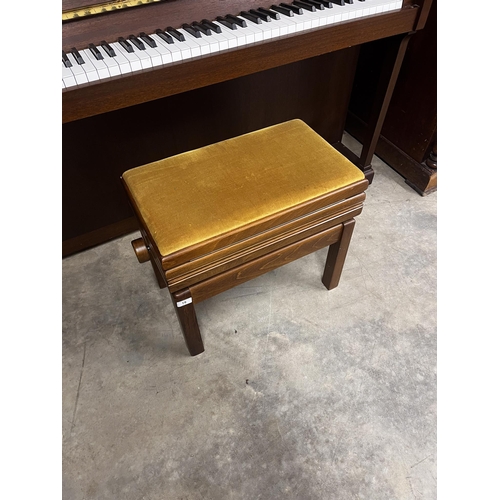 19 - Yamaha (c2000)A Model P110N upright piano in a modern style satin mahogany case; together with a sto... 