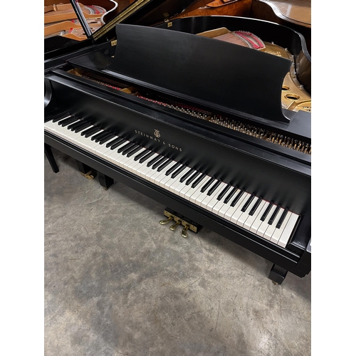 20 - Steinway (c1976)A 5ft 7in New York Model M grand piano in an ebonised case on square tapered legs.... 
