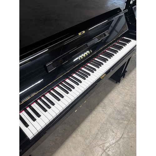 21 - *Yamaha (c1978)A Model U1H upright piano in a traditional bright ebonised case. There is VAT on this... 