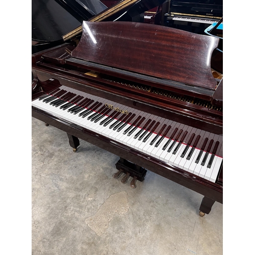 24 - Offenbach by DaewooA recent 5ft grand piano in a bright mahogany case on square tapered legs; togeth... 