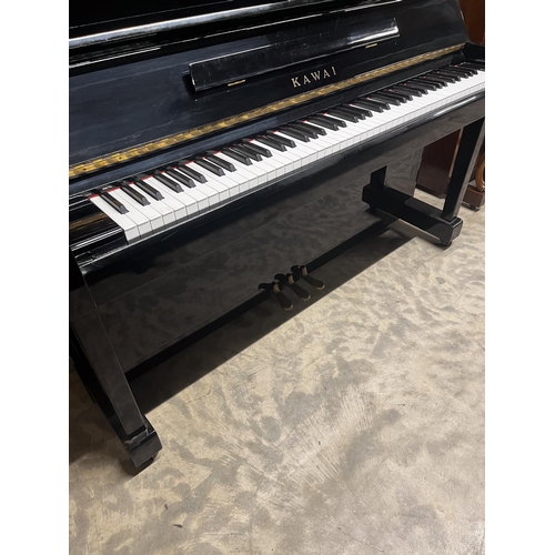 27 - Kawai (c1985)A Model KS-2F upright piano in a bright ebonised case; together with a stool.