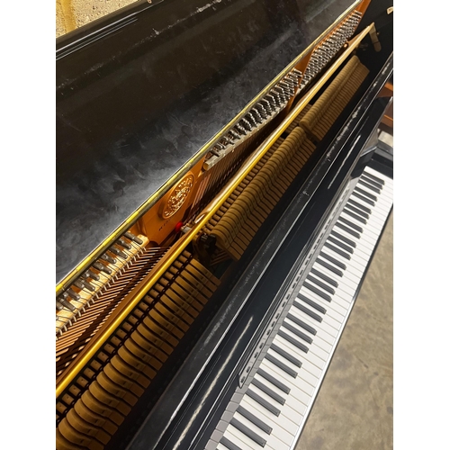 27 - Kawai (c1985)A Model KS-2F upright piano in a bright ebonised case; together with a stool.