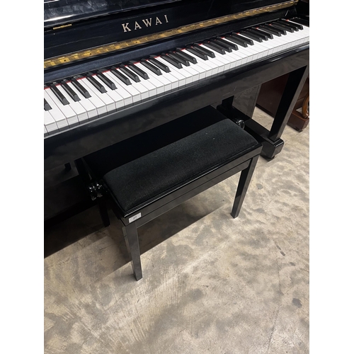 27 - Kawai (c1985)A Model KS-2F upright piano in a bright ebonised case; together with a stool.