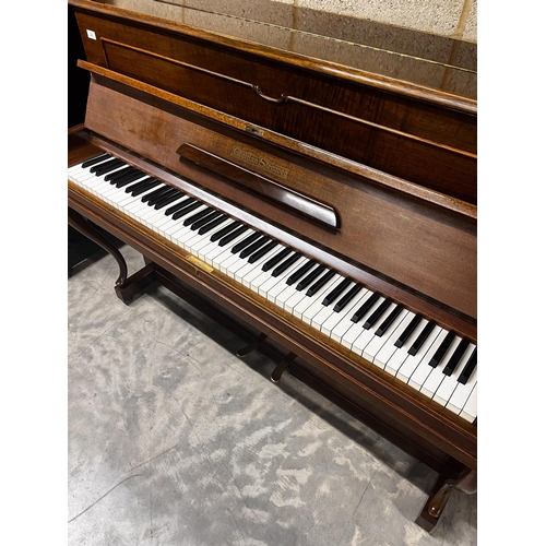 34 - Grotrian Steinweg (c1956)An upright piano in a traditional walnut case; together with a duet stool. ... 