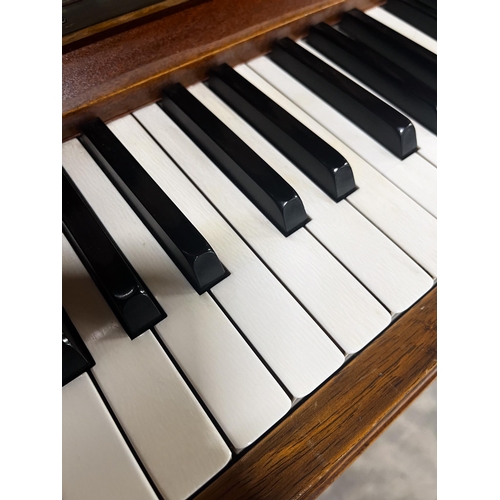 34 - Grotrian Steinweg (c1956)An upright piano in a traditional walnut case; together with a duet stool. ... 