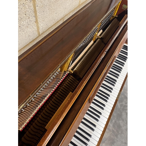 34 - Grotrian Steinweg (c1956)An upright piano in a traditional walnut case; together with a duet stool. ... 