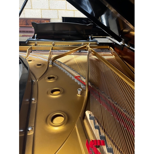 40 - Steinway (c1981)A 9ft Model D concert grand piano in a satin ebonised case on square tapered legs.... 