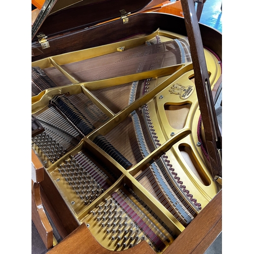 42 - Schimmel (c1988)A 5ft 8in Model 174T grand piano in bright walnut case on square tapered legs.