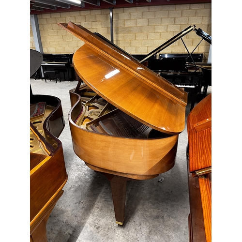 42 - Schimmel (c1988)A 5ft 8in Model 174T grand piano in bright walnut case on square tapered legs.