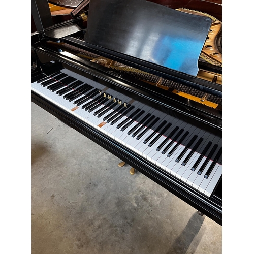 56 - Yamaha (c1957)A 5ft 7in Model G2 grand piano in a bright ebonised case on square tapered legs; toget... 