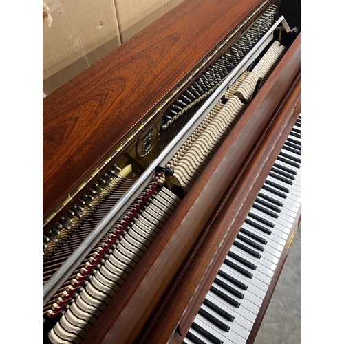 58 - Welmar (c1998)An upright piano in a traditional satin mahogany case; together with a stool.
