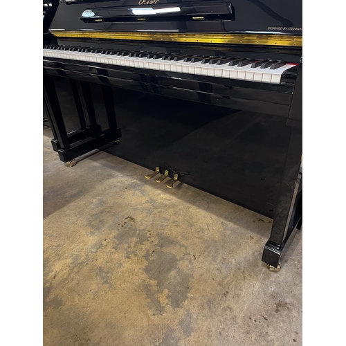 59 - *Essex (c2012)A Model 123 upright piano in a bright ebonised case. There is VAT on this Lot.