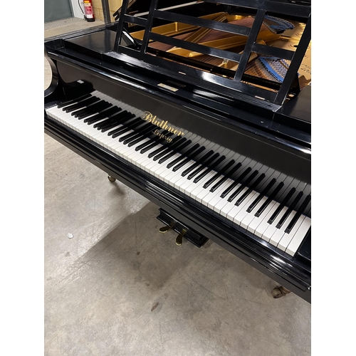 6 - Blüthner (1910)A 6ft 3in grand piano in an ebonised case on turned fluted legs. IRN: 289FFRPV